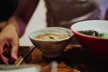 bowl of noodles and chopsticks 