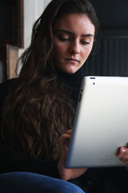 a woman using a tablet 