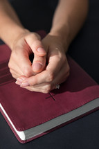 Close Up Of Christian Woman Hands Folded On Holy Bible Are Pray And Worship