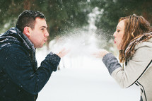 couple playing in snow 