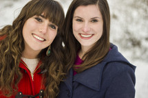 Two girls outdoors in the snow