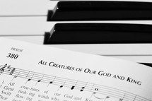 All Creatures of Our God and King sheet music on a piano 