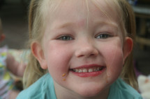 food on a little girls face 