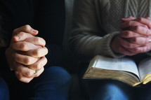 women praying at a Bible study 