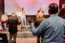 Man with raised hands in worship