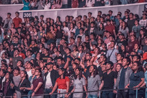 audience singing at a concert 