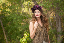 woman in a fur vest and flower hat 