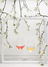 Glasses Of Rose and White Wine Inside A Frame with Cherry Blossom