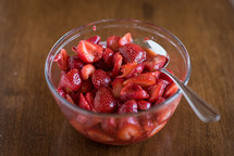 strawberries and sugar in a bowl 