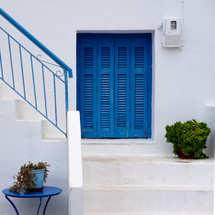 white steps and blue doors 