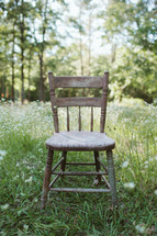 isolated chair in a meadow