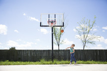 a boy playing basketball 