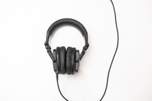 Black headphones on an isolated white background with copy space