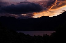 A mountain lake illuminated by a beautiful sunset.