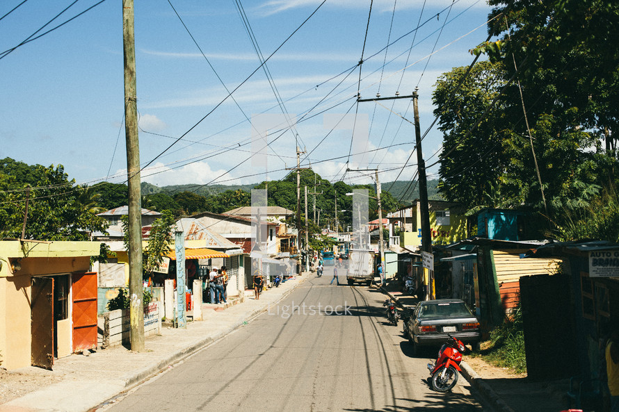 power lines over a narrow island street 