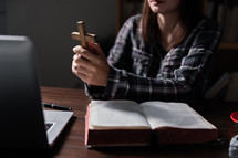 Women with Bible and technology