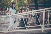a woman walking up a ramp 