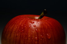 water droplets on a red apple 