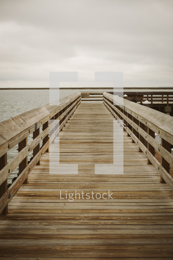 a wooden pier over water 