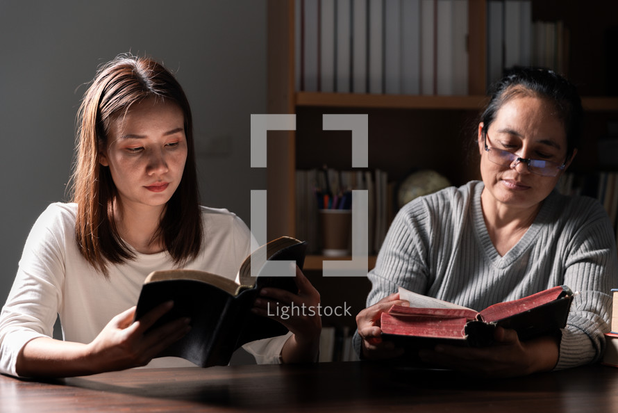 Women reading their Bibles