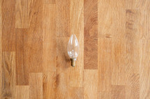 lightbulb on a wood background 
