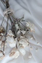 Wilted Rose With Soft Background, A small dried unripe rose, Dried roses on a brown background