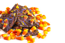 candy corn and Chocolate Halloween Bark on a white background 