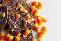 candy corn and Chocolate Halloween Bark on a white background 
