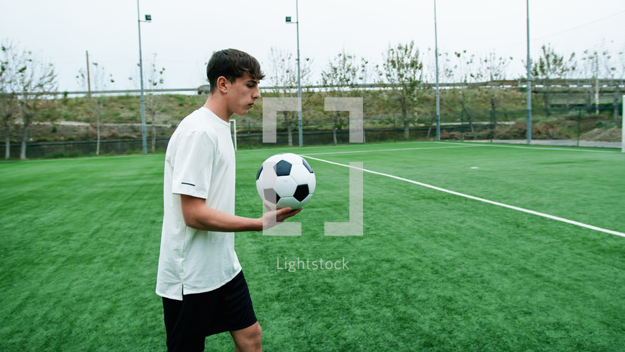 Teenager Does Freestyle Soccer Dribbles In The Field