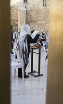 people praying at the wall in Jerusalem 