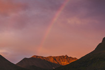 a rainbow over a mountain 