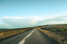 long rural highway on flat land 