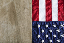 American flag alongside old wood plank.