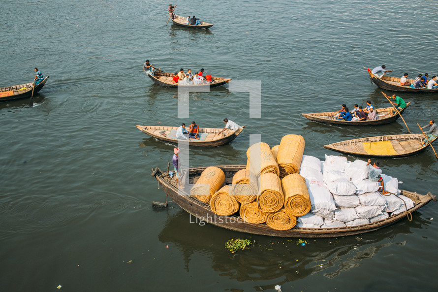 Boats with fishermen in Dhaka river in Bangladesh