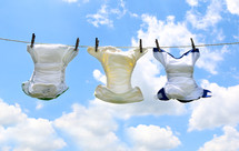 diapers drying on a clothesline 