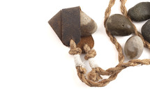 A Sling Shot and Stones Isolated on a White Background from the Story of David and Goliath in the BIble 