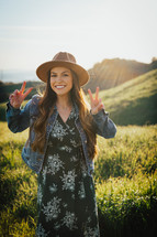 woman giving peace signs 
