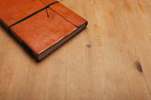 leather journal on a table