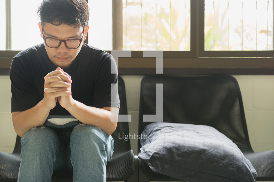 man sitting in prayer 