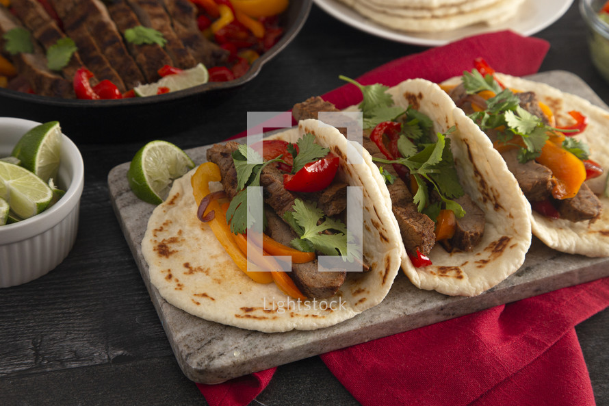 Beef Fajitas with Bell Peppers on a  Wood Table
