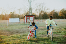 kids riding bikes on a farm 