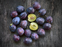 plums on a wood background 