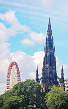 The Scotts Monument and Ferris Wheel in Edinburgh Scotland