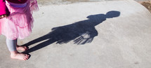shadow from a little girl on concrete