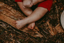 toddler boy with dirty feet 