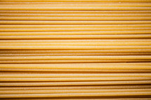 A pile of spaghetti dry on the table. Against a dark background. High quality photo