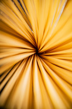 A pile of spaghetti dry on the table. Against a dark background. High quality photo