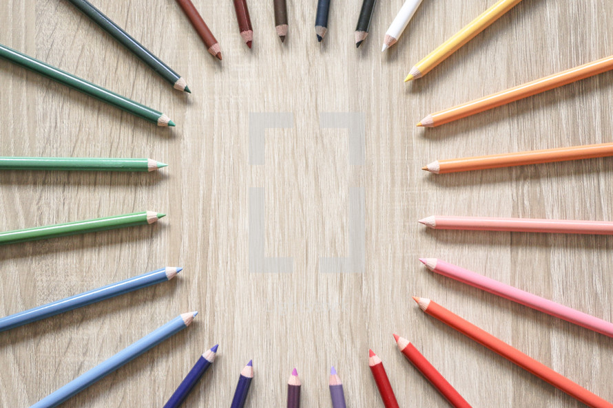 circular border of colored pencils 