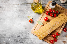 A pile of spaghetti dry on the table. Against a dark background. High quality photo