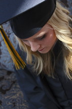 teen girl in her cap and gown